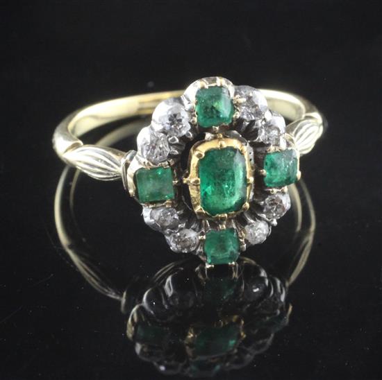A Victorian 18ct gold and silver, emerald and diamond cluster ring, size O